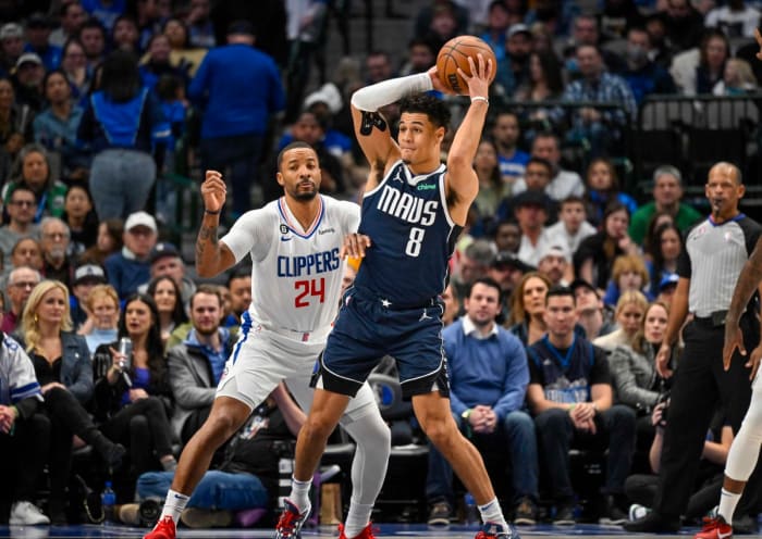 Mavs' Josh Green passes out of the post against Clippers' Normal Powell.